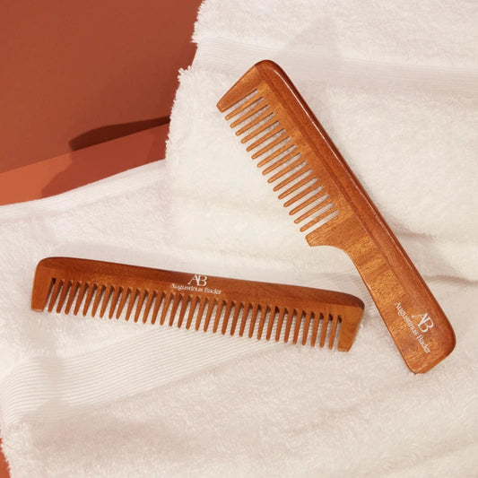 Augustinus Bader neem wood combs on white towels